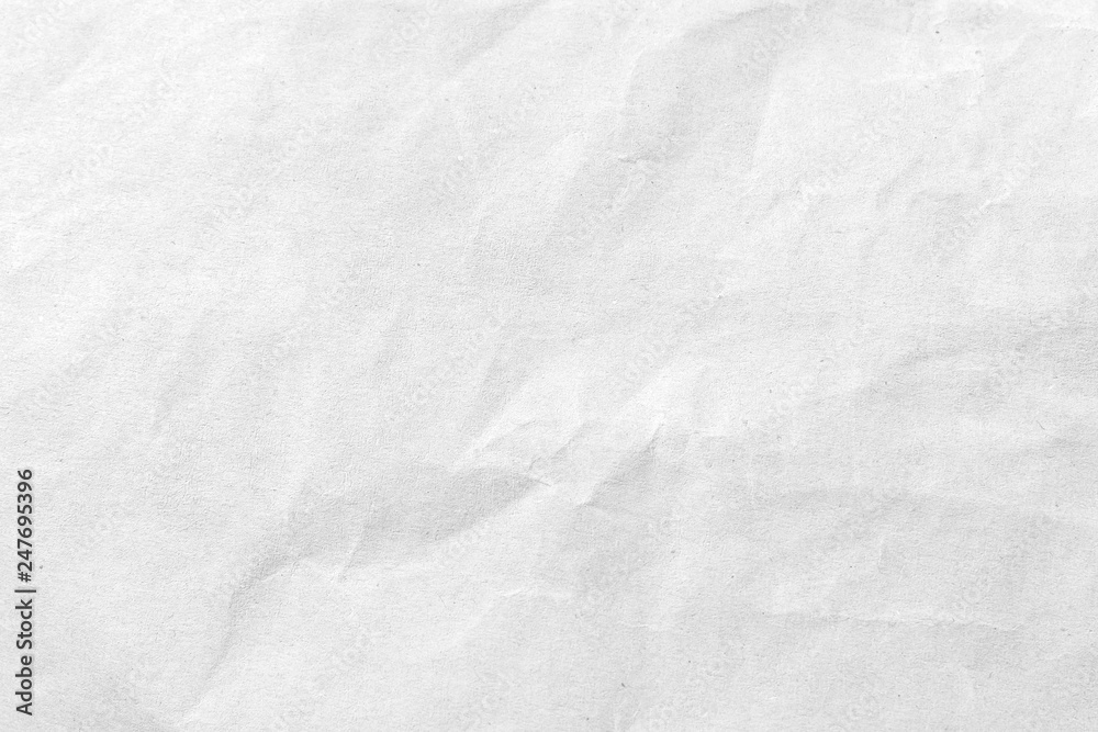 Obraz premium White crumpled paper texture background. Close-up.