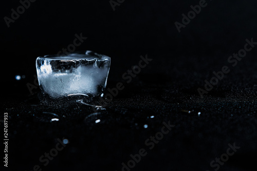 ice cube on black background photo