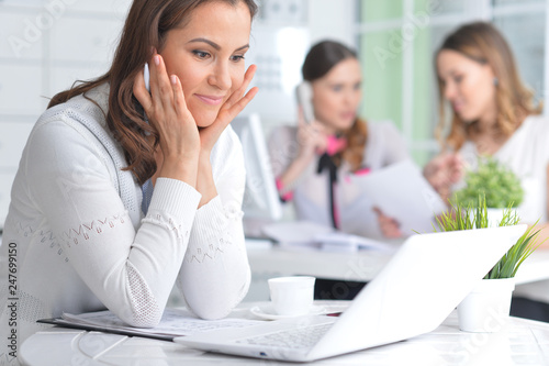 Portrait of young women working in modern office