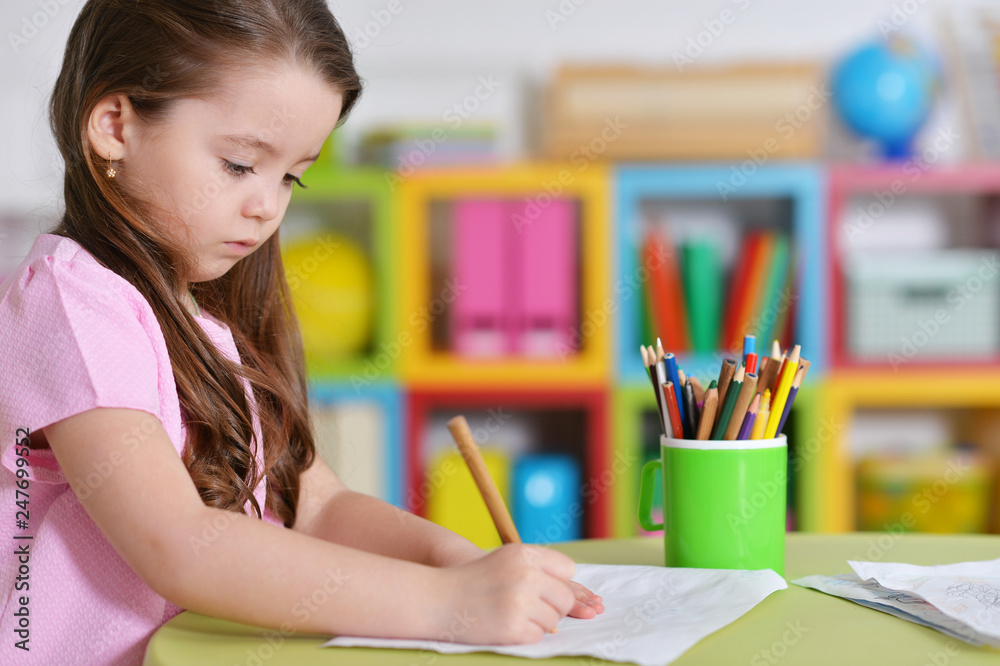 Cute little girl in pink shirt drawing Cute little girl in pink shirt drawing