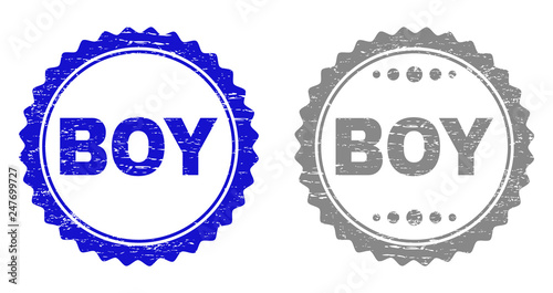 Grunge BOY stamp seals isolated on a white background. Rosette seals with grunge texture in blue and gray colors. Vector rubber imitation of BOY title inside round rosette.