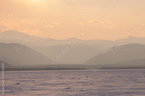 panorama winter mountain misty hills mountain tops in pink dawn