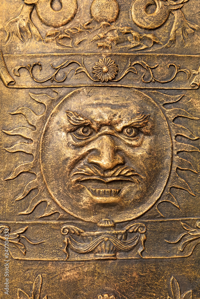 Character faces on copper metal plates