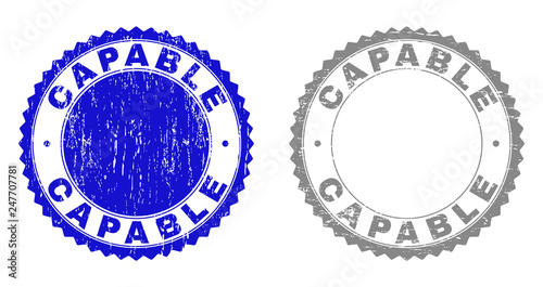 Grunge CAPABLE stamp seals isolated on a white background. Rosette seals with grunge texture in blue and grey colors. Vector rubber watermark of CAPABLE text inside round rosette.