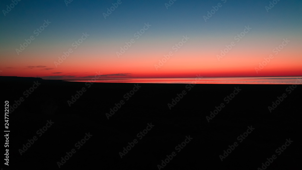 Sunrise Panorama view to Aral sea from the rim of Plateau Ustyurt near Aktumsuk cape in Karakalpakstan, Uzbekistan