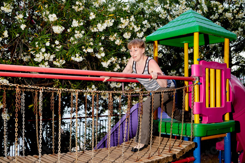 Middle-aged woman on the Playground outdoors