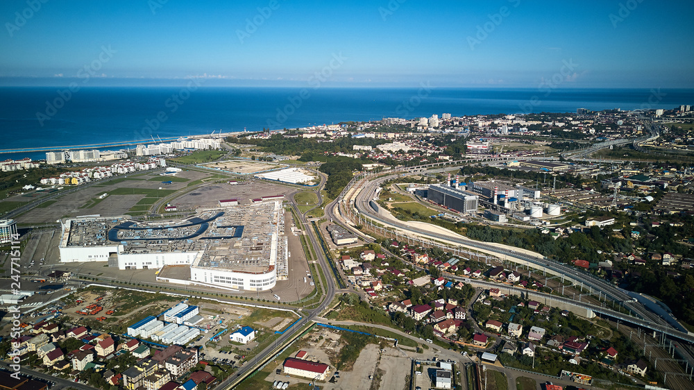 Fototapeta premium Sochi, Russia - September 1, 2018: New modern building of the Main Olympic Media Center is used as a venue for the Russian International Investment Forum. Entrance view with clear blue sky at summer