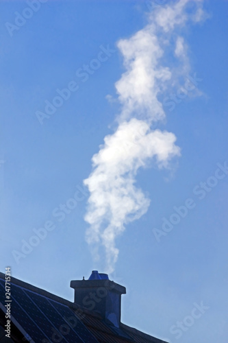 Fotografie, Obraz white smoke escaping from the chimney of a house