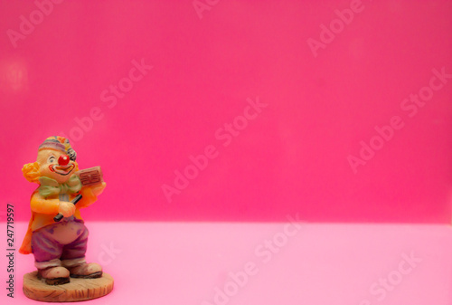 Children's cute toys figurines on a pink background