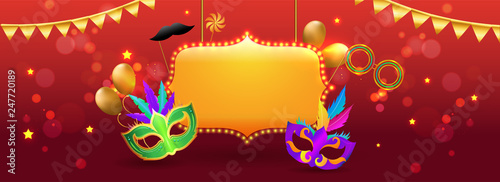 Marquee light frame with party masks and props on red bokeh background for Carnival party celebration header or banner design.