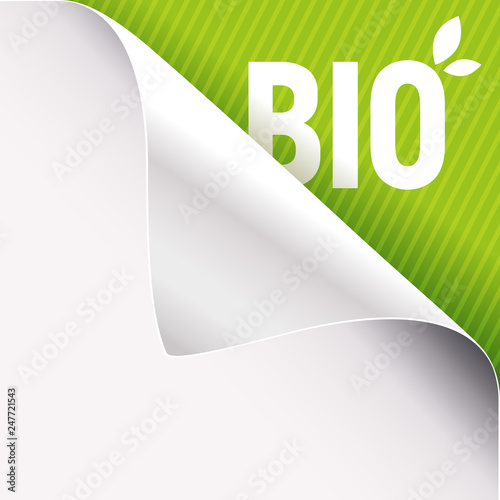 Curled white paper corner on green and Bio sign