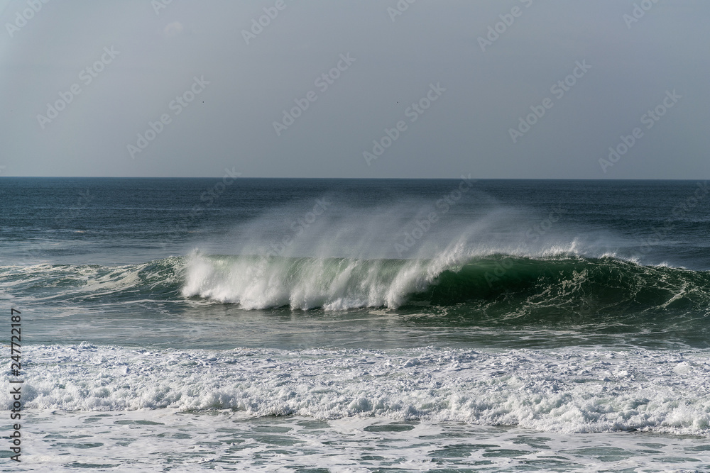 Atlantic ocean waves by Nazare North beach,  Portugal.