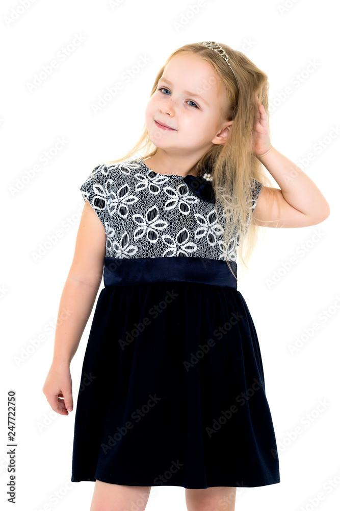 Little girl posing in studio on a white background.