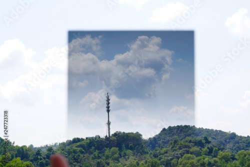Wallpaper Mural A Man hand holding gradual Neutral Density filter pointing at the sky Torontodigital.ca
