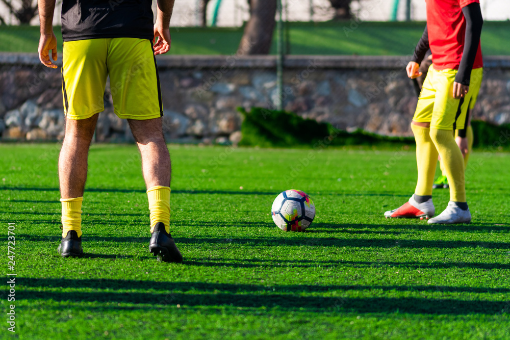 soccer player with ball on field