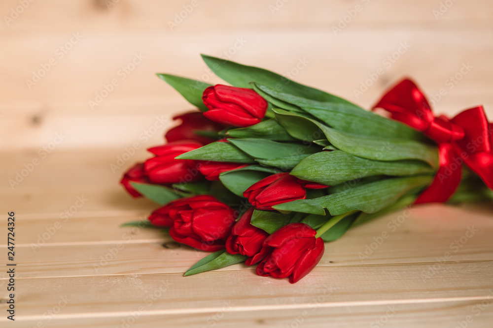 Beautiful Rustic background with Red Tulips. Colorful Card for Mothers Day, Birthday, International Women's Day March 8