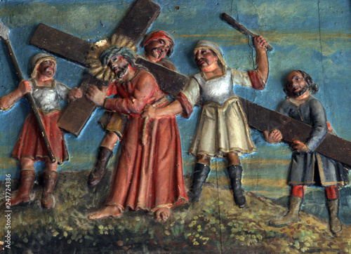 Simon of Cyrene carries the cross