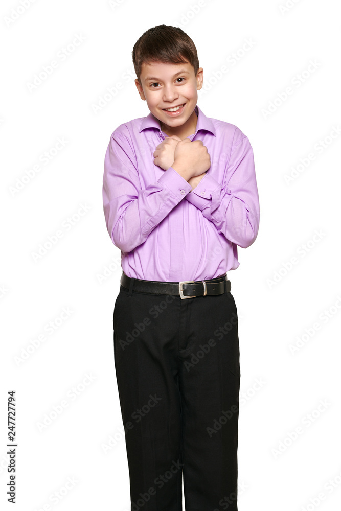 Boy posing on white background, black trousers and purple shirt Boy posing on white background, black trousers and purple shirt