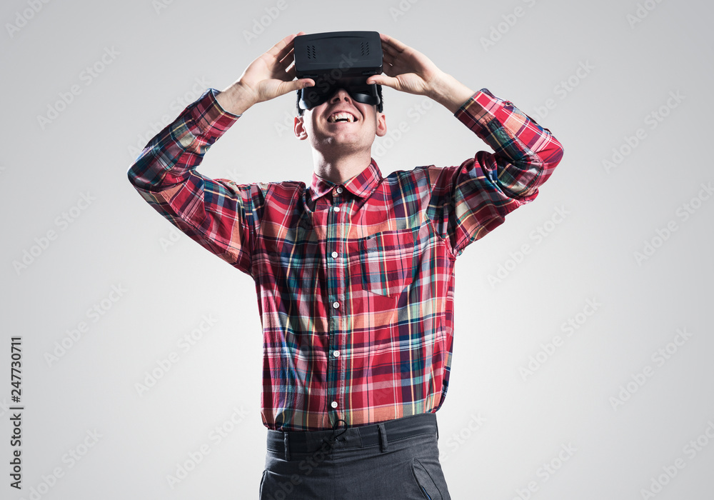 Guy in mask experiencing virtual reality as new entertainment device Guy in mask experiencing virtual reality as new entertainment device