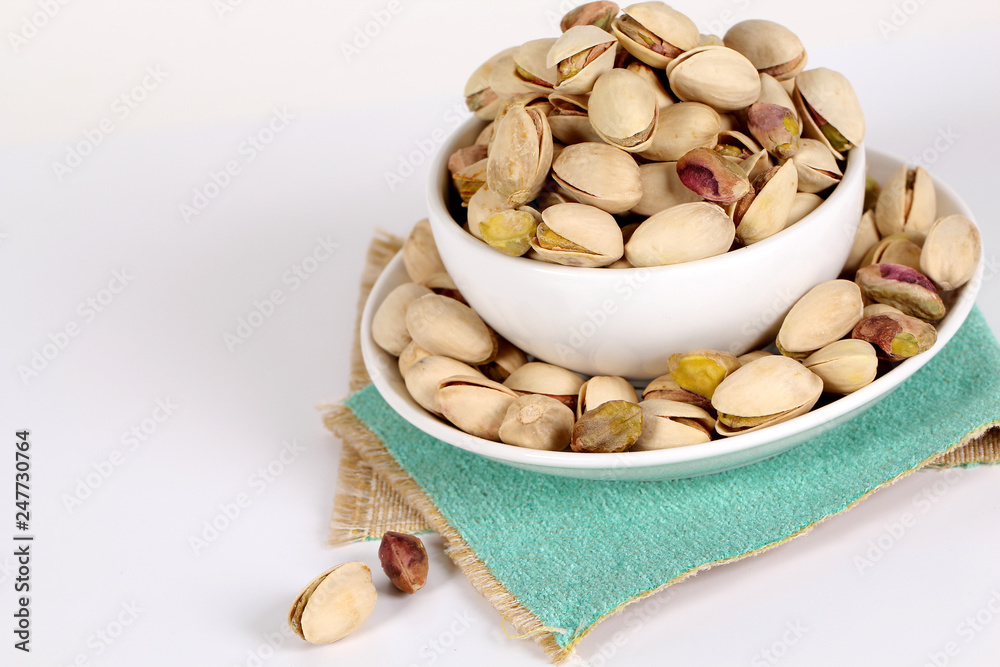 pistachios on a white background pistachios on a white background