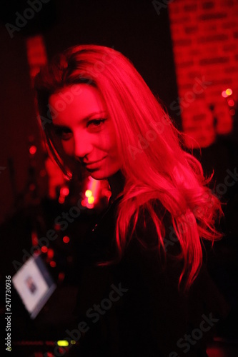 Portrait of a beautiful young woman in a nightclub. 