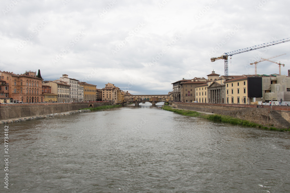 Arno river and Ponte Vecchio bridge in Florence. Tuscany, Italy.