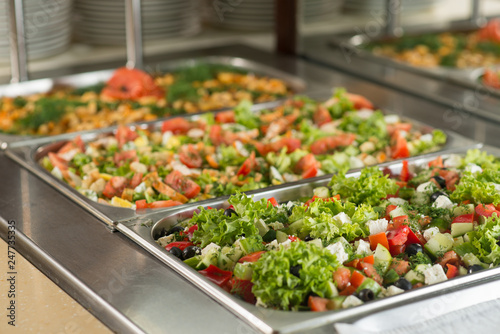 Obraz na płótnie Fresh salads in boilers on the buffet table