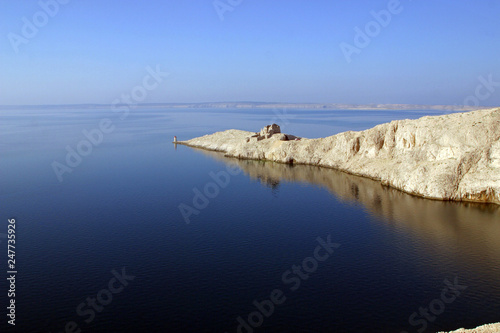 Lighthouse and the ruins of the far south point of the island Pag in Croatia