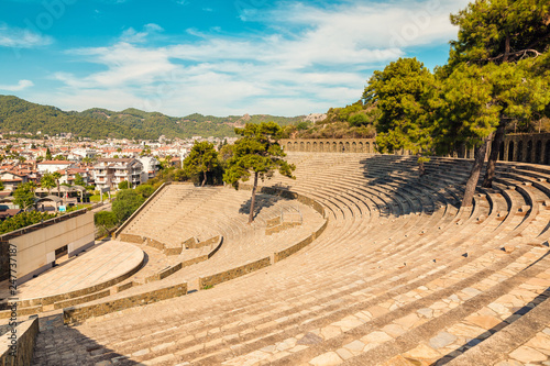 Panoramic view of old amphitheater in Marmaris Town. Reconstructed open-air stone theater. Marmaris is popular tourist destination in Turkey