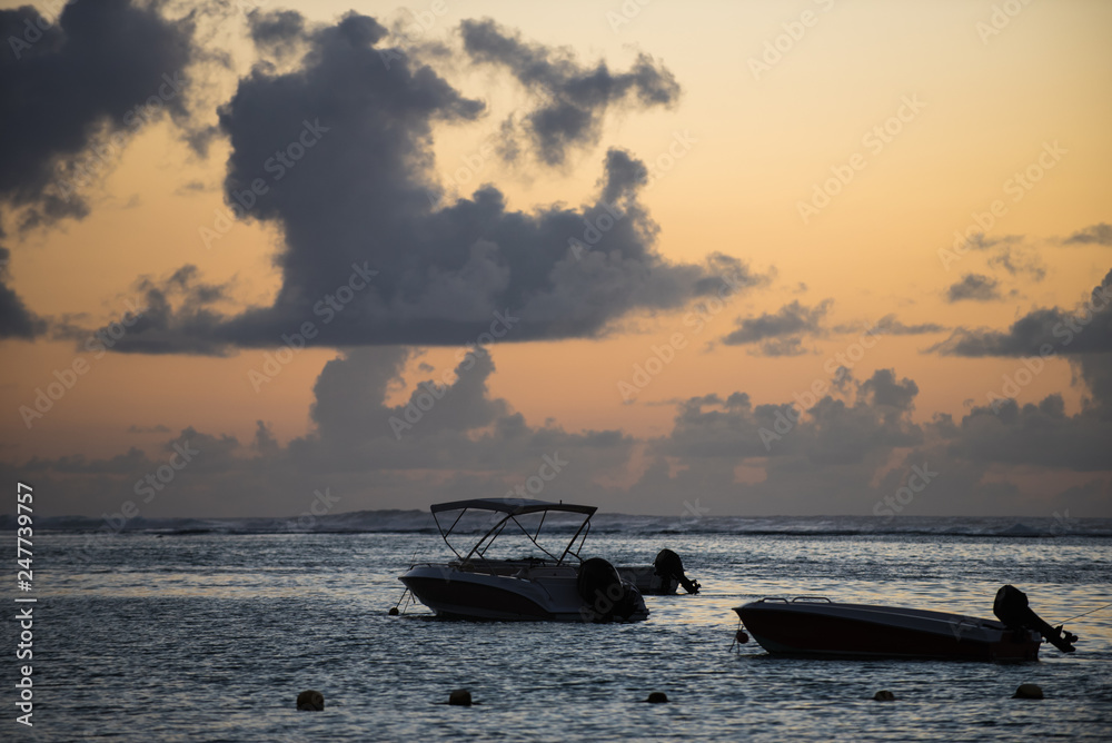 Boat silhouettes at sunrise beach Boat silhouettes at sunrise beach