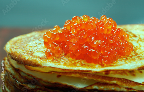 Russian pancakes  with red caviar photo