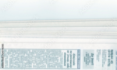 stack of old Newspapers on a white background