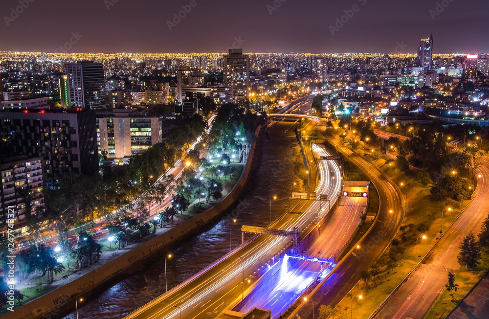 Night view of Santiago de Chile toward the east part of the city, showing the Mapocho river and Providencia and Las Condes districts