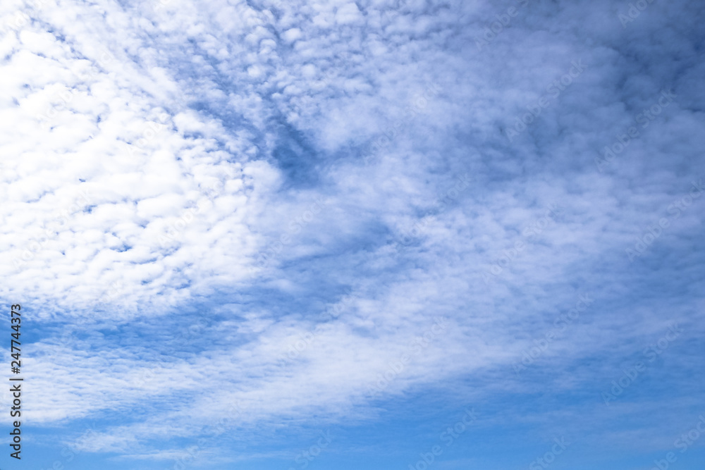 Background of Cirrocumulus white clouds in the blue sky in sunny day.
