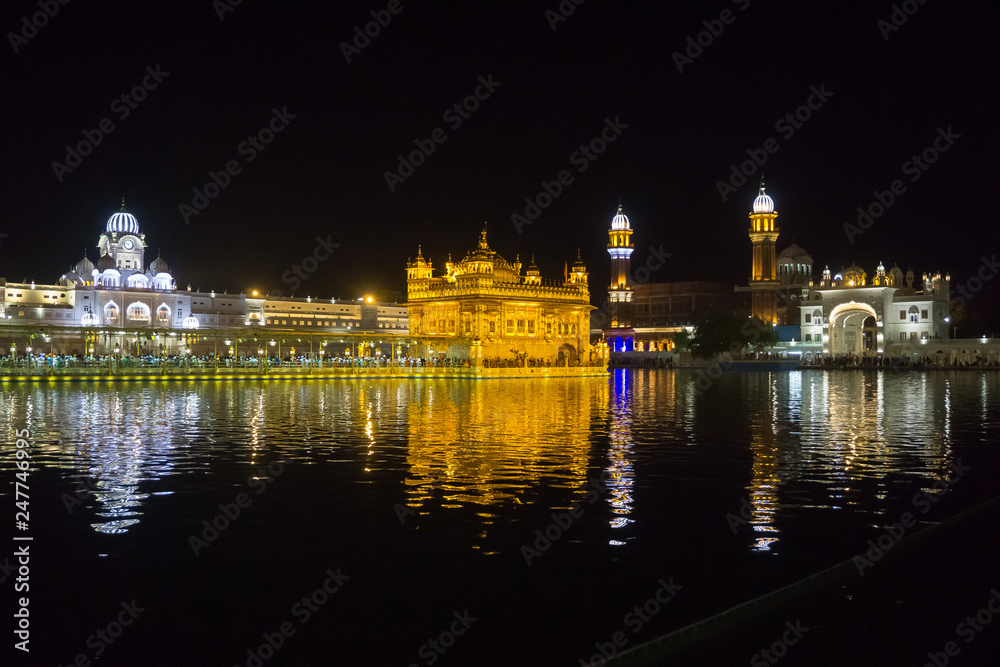The sacred Golden Temple in the middle of the sacred lake at night time