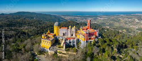 Aerial view of Pena Palace, castle stands on Sintra Mountains; monument and one of the Seven Wonders of Portugal, mixture of eclectic styles includes the Neo-Gothic, Manueline, Islamic, Renaissance photo