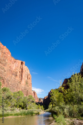 the cliff face of zion national park on a clear crisp blue autumn day