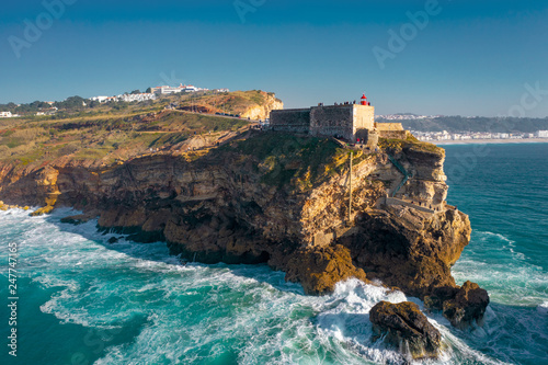 Aerial; drone flight near Farol de Nazare, sighseeing of Portugal; a place where some of the biggest waves form