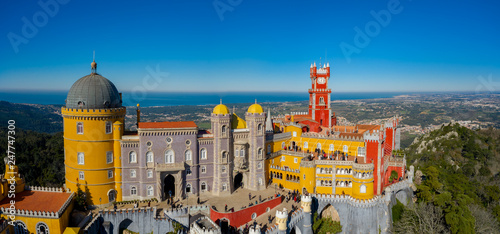 Aerial view of Pena Palace, castle stands on Sintra Mountains; monument and one of the Seven Wonders of Portugal, mixture of eclectic styles includes the Neo-Gothic, Manueline, Islamic, Renaissance