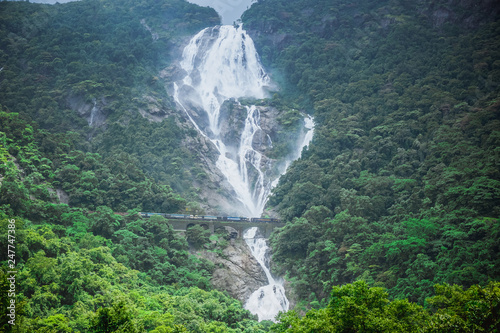 The huge waterfall Dudhsagar and the railway bridge passing through it. Karnataka, India