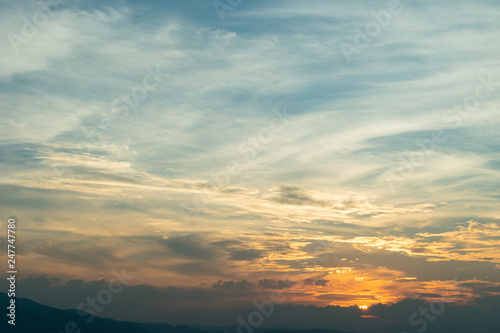 sunlight through cloud on dramatic sunset sky © sutichak