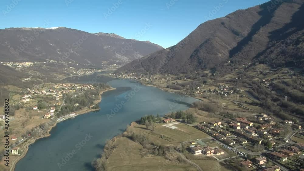 Panoramic aerial view of partially frozen Lake Endine, one of the most attractive tourist sites in the province of Bergamo, Italy Panoramic aerial view of partially frozen Lake Endine, one of the most attractive tourist sites in the province of Bergamo, Italy