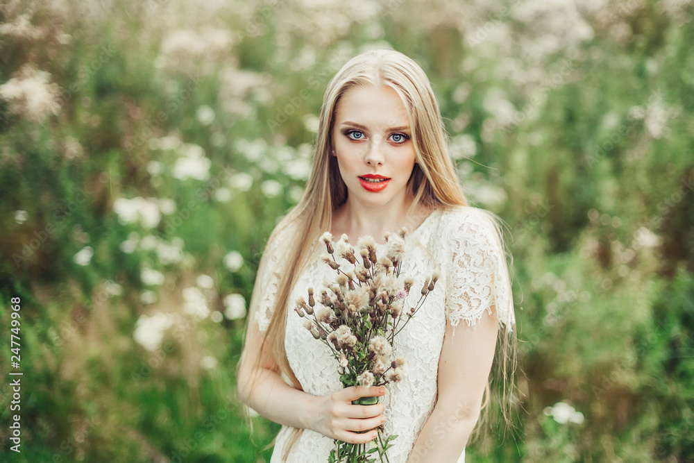 Close up natural portrait of young happy cute cheerful caucasian beautiful girl witn long natural blondie hair walking in park in summer evening Close up natural portrait of young happy cute cheerful caucasian beautiful girl witn long natural blondie hair walking in park in summer evening
