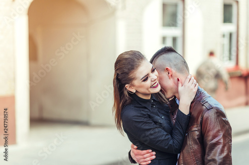 Young hipster modern sexy couple in love hugging outdoors. Freedom, emotional, love, happiness concept