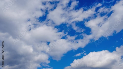 Clouds running over blue sky. 4k timelapse video of white clouds over blue sky background photo