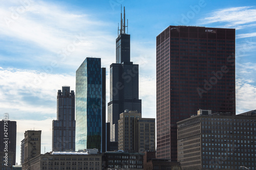 Chicago downtown cityscape with skyscrapers, aerial or bird-eyes view, cloudy day.