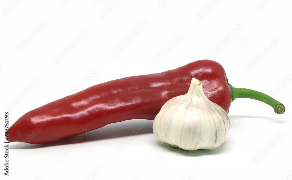 Red pepper and garlic on white background.