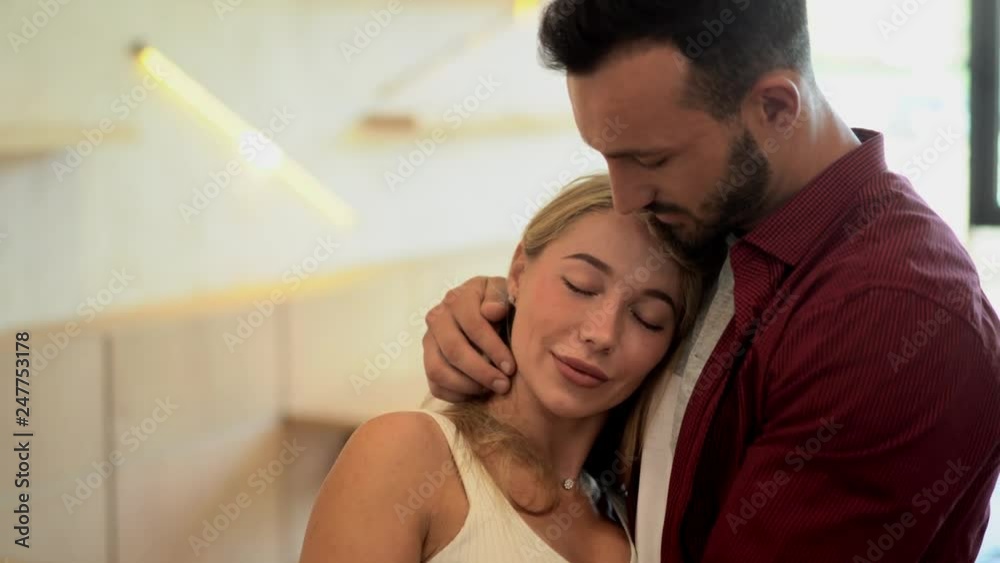 Couple in love hugging. Inside a cafe Couple in love hugging. Inside a cafe