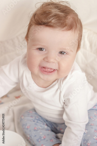 Portrait of joyfil, happiness baby in the bedroom, blurred background