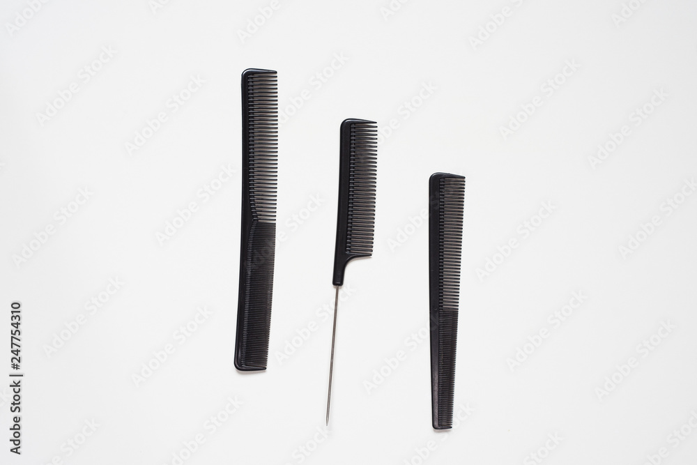 flat lay set of salon hairdressing black combs in order isolated on white background flat lay set of salon hairdressing black combs in order isolated on white background